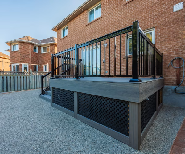 composite deck (dark grey, fascia, black railing)